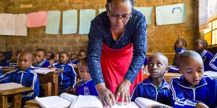 A teacher and her students in class, Kenya